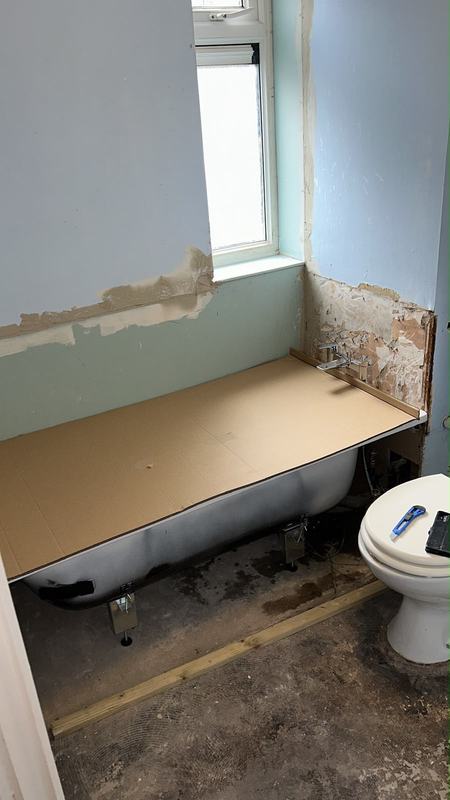 Bathroom renovation with new tub and window framing