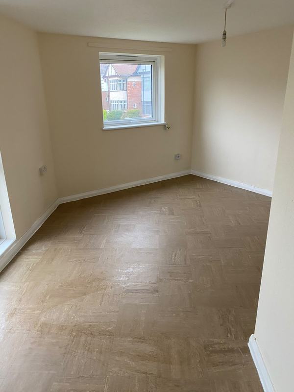 Bedroom with wooden floor and window
