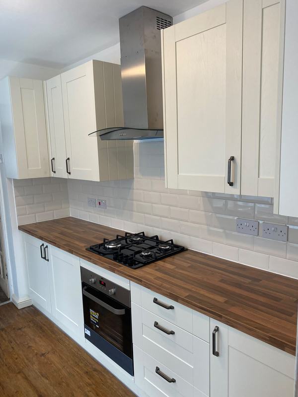 Modern kitchen with gas hob and range hood